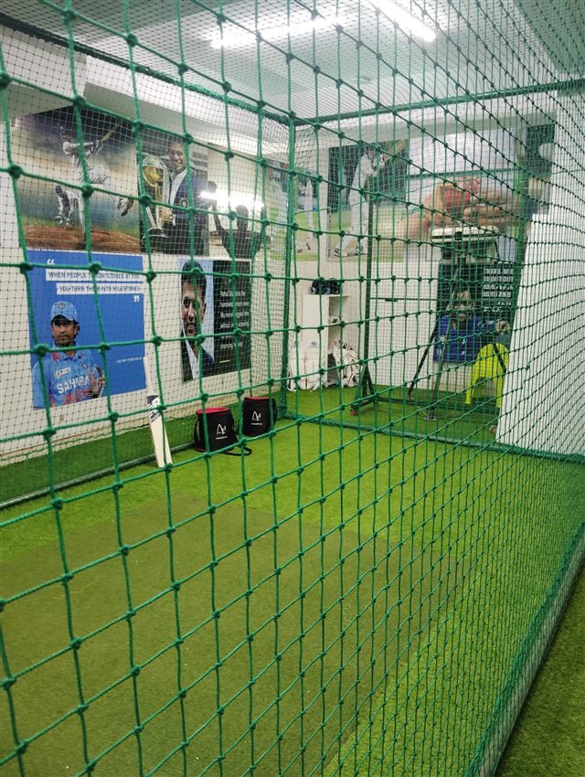 Machine and practice equipment inside the nets.