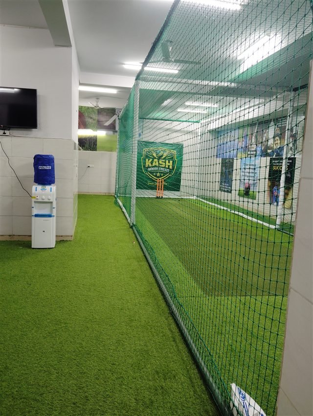 A view along the netted indoor practice area